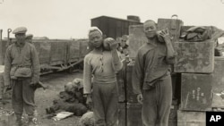 Members of the Chinese Labour Corps move munitions during World War I
