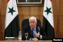 Syria's Foreign Minister Walid al-Moualem speaks during a news conference in Damascus, Syria, March 12, 2016.