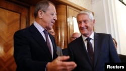 Russia's Foreign Minister Sergei Lavrov (L) welcomes Secretary-General of the Council of Europe Thorbjorn Jagland before their meeting in Moscow, September 4, 2014.