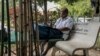 A patient with kidney disease rests on a bench at a dialysis center, in Phnom Penh, Cambodia, January 23, 2018. (Khan Sokummono/ VOA Khmer)