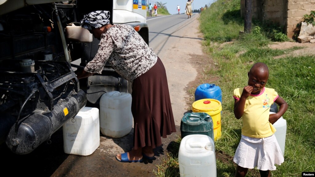 Residents of Ntuzuma collect water from a truck after cuts in water supply were made due to persistent drought conditions, in Durban, South Africa, Jan. 22, 2017.