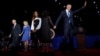 President Barack Obama (R) is joined onstage by first lady Michelle Obama and daughter Malia, Vice President Joe Biden and his wife Jill Biden, after his farewell address in Chicago, Illinois, Jan. 10, 2017. 