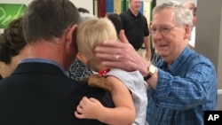 Senate Majority Leader Mitch McConnell greets constituents at the Graves County Republican Breakfast in Mayfield, Ky., Aug. 5, 2017. McConnell told Republicans not to be disheartened by the Senate's failure to repeal and replace former President Barack Obama's health care law, telling them: "We're not through."