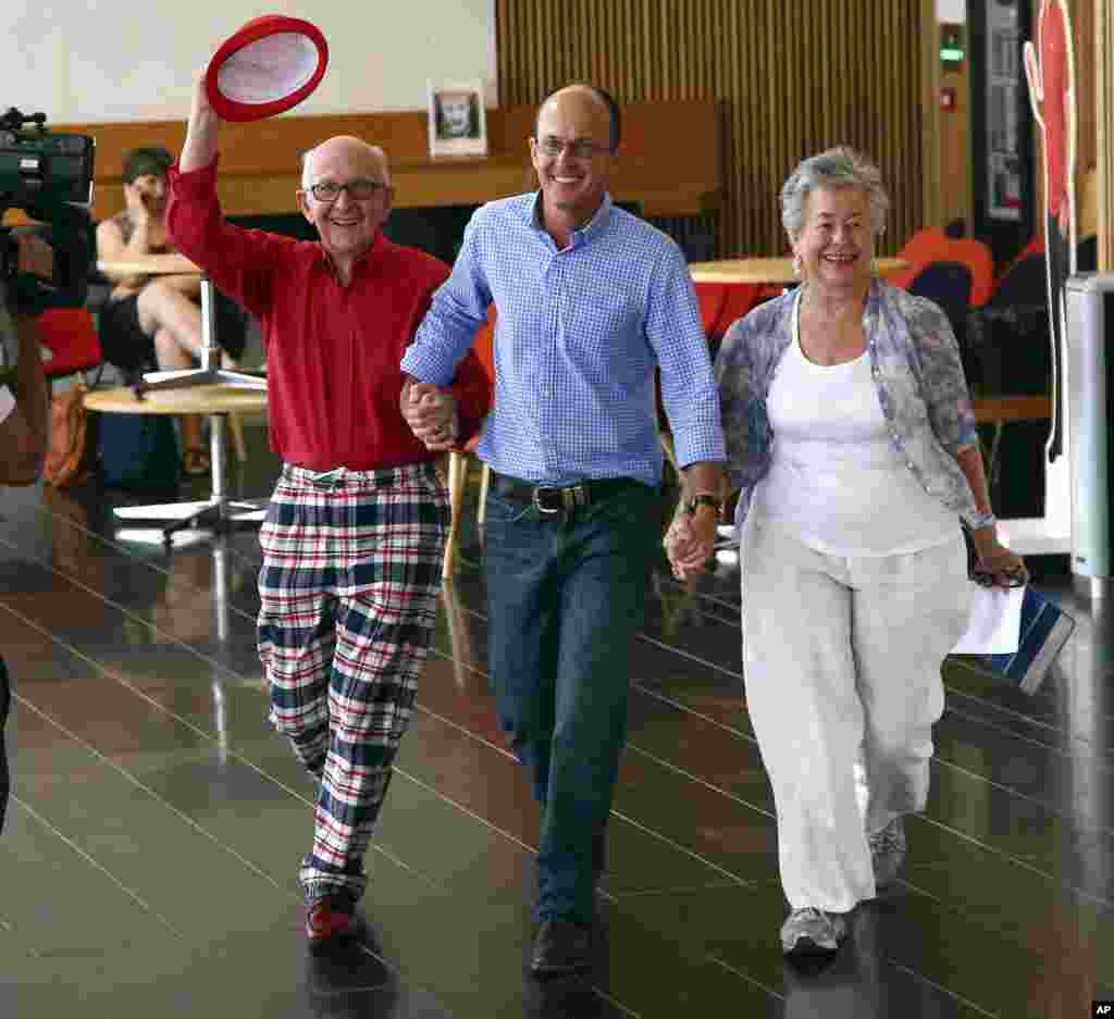 Juris (left) and Lois Greste, parents of Australian journalist Peter Greste, and his brother Andrew arrive at a press conference in Brisbane, Australia, Feb. 2, 2015.