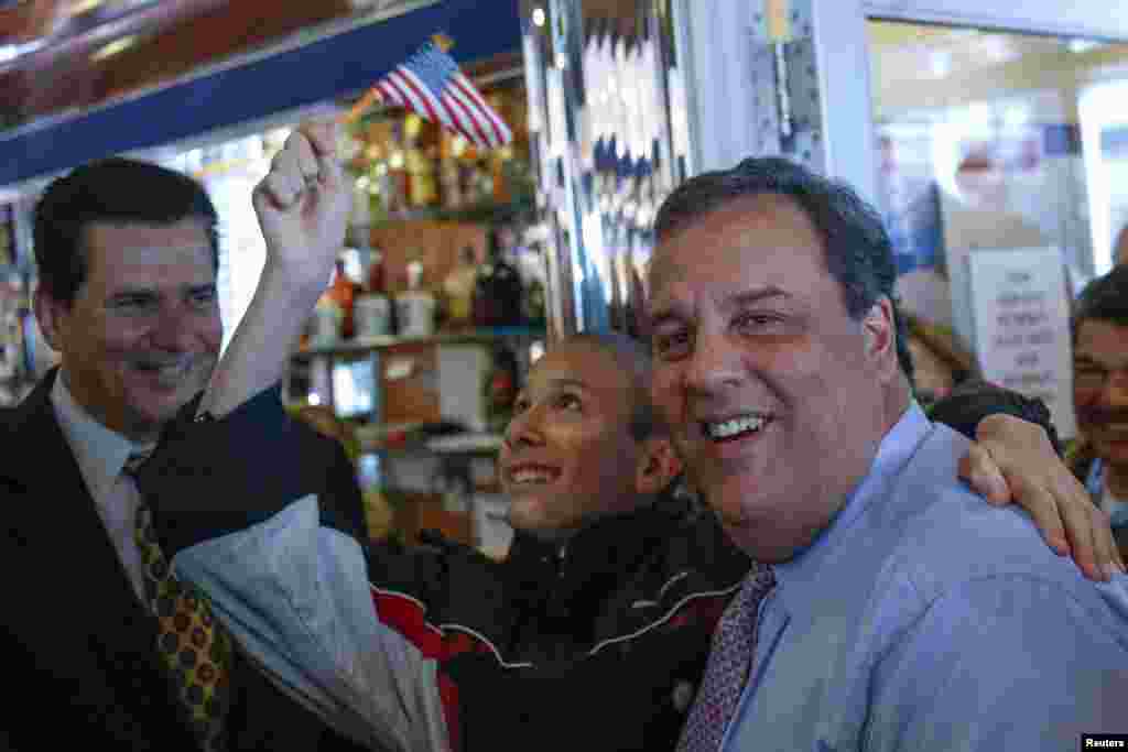 New Jersey Governor Chris Christie poses for a photo during a campaign stop at the Nutley Diner in Nutley, New Jersey, Nov. 4, 2013. Christie was campaigning in his re-election race for governor against Democratic state Senator Barbara Buono. 
