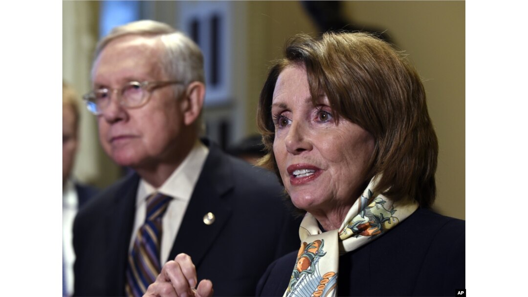 House Democratic Leader Nancy Pelosi of Calif., right, speaks as Senate Minority Leader Harry Reid of Nev., left, listens as she talks to reporters on Capitol Hill in Washington, Wednesday, Oct. 28, 2015.