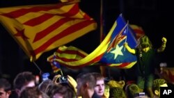 Catalonian pro-independence supporters celebrate in Barcelona, Spain, Sept. 27, 2015. 