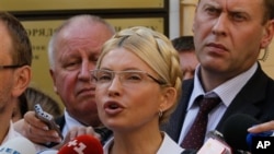 Former Ukrainian Prime Minister Yulia Tymoshenko speaks to the press at the Pecherskiy District Court in Kyiv, Aug. 5, 2011