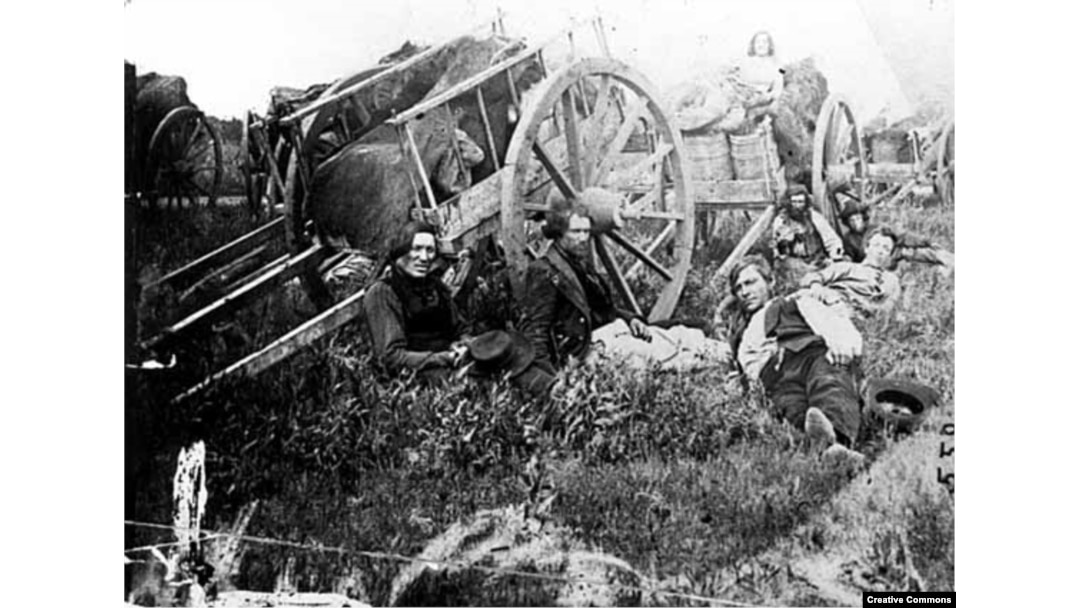 Métis men with Red River carts, possibly taken in Minnesota. 1859 photo by an unknown photographer