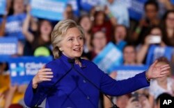 FILE - Democratic presidential candidate Hillary Clinton speaks at a campaign rally in Tempe, Ariz., Nov. 2, 2016. In a campaign stop the following day in Florida, Clinton said Donald Trump "has spent this entire campaign offering a dog whistle to his most hateful supporters."