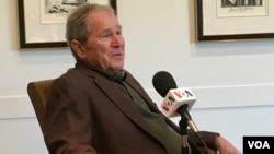 Former president George W. Bush is interviewed by VOA's Kane Farabaugh at the Bush Presidential Museum in Dallas, Texas.