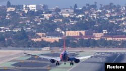 FILE - A Southwest Airlines plane approaches to land at San Diego International Airport. Wireless companies in the U.S. said they would delay the start of high-speed 5G service near some airports after warnings from airlines of possible disruptions. (REUTERS/Mike Blake/File)