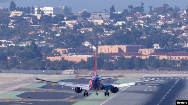 FILE - A Southwest Airlines plane approaches to land at San Diego International Airport. Wireless companies in the U.S. said they would delay the start of high-speed 5G service near some airports after warnings from airlines of possible disruptions. (REUTERS/Mike Blake/File)