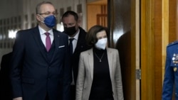 French Minister of Defense Florence Parly, right, arrives for joint statements alongside her Romanian counterpart Vasile Dincu, left, at the defense ministry headquarters in Bucharest, Romania, Jan.27, 2022.