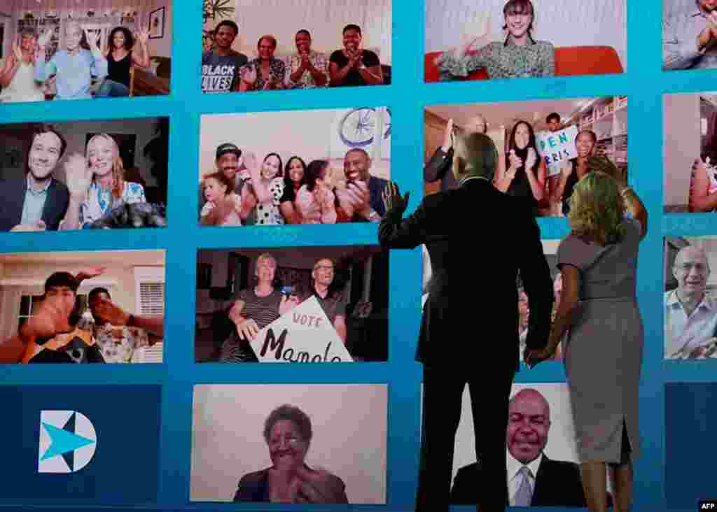 Joe Biden and his wife wave to supporters watching remotely after he accepted the Democratic Party nomination for U.S. president during the last day of the Democratic National Convention, being held virtually, in Wilmington, Delaware, Aug. 20, 2020.