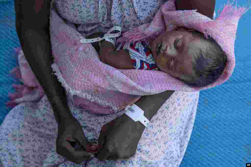 Terhas Tsfa, 25, who gave birth on a street as she fled the conflict in Ethiopia&#39;s Tigray region, holds her baby at Um Rakuba refugee camp in Qadarif, eastern Sudan, Nov. 23, 2020.