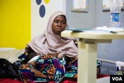 Aisha Suleiman, 32, breastfeeds her day-old child. She experienced postpartum hemorrhage during the delivery and lost three pints of blood.(Photo: Chika Oduah for VOA)