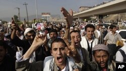 Protesters shout slogans during a demonstration demanding the resignation of Yemen's President Ali Abdullah Saleh, in Sana'a, August, 2011