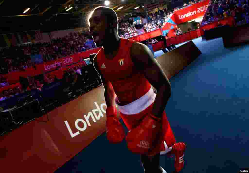 Julio la Cruz Peraza of Cuba arrives for his Men's Light Heavy (81kg) quarter-final boxing match against Brazil's Yamaguchi Falcao Florentino.