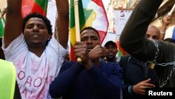 FILE - Ethiopian migrants, all members of the Oromo community of Ethiopia living in Malta, protest in Valletta against the Ethiopian regime's plan to evict Oromo farmers to expand Ethiopia's capital, Addis Ababa, Dec. 21, 2015.