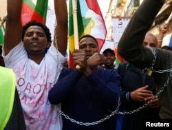 FILE - Ethiopian migrants, all members of the Oromo community of Ethiopia living in Malta, protest in Valletta against the Ethiopian regime's plan to evict Oromo farmers to expand Ethiopia's capital, Addis Ababa, Dec. 21, 2015.