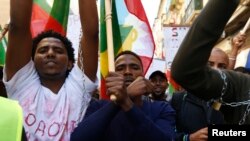 FILE - Ethiopian migrants, all members of the Oromo community of Ethiopia living in Malta, protest in Valletta against the Ethiopian regime's plan to evict Oromo farmers to expand Ethiopia's capital, Addis Ababa, Dec. 21, 2015.