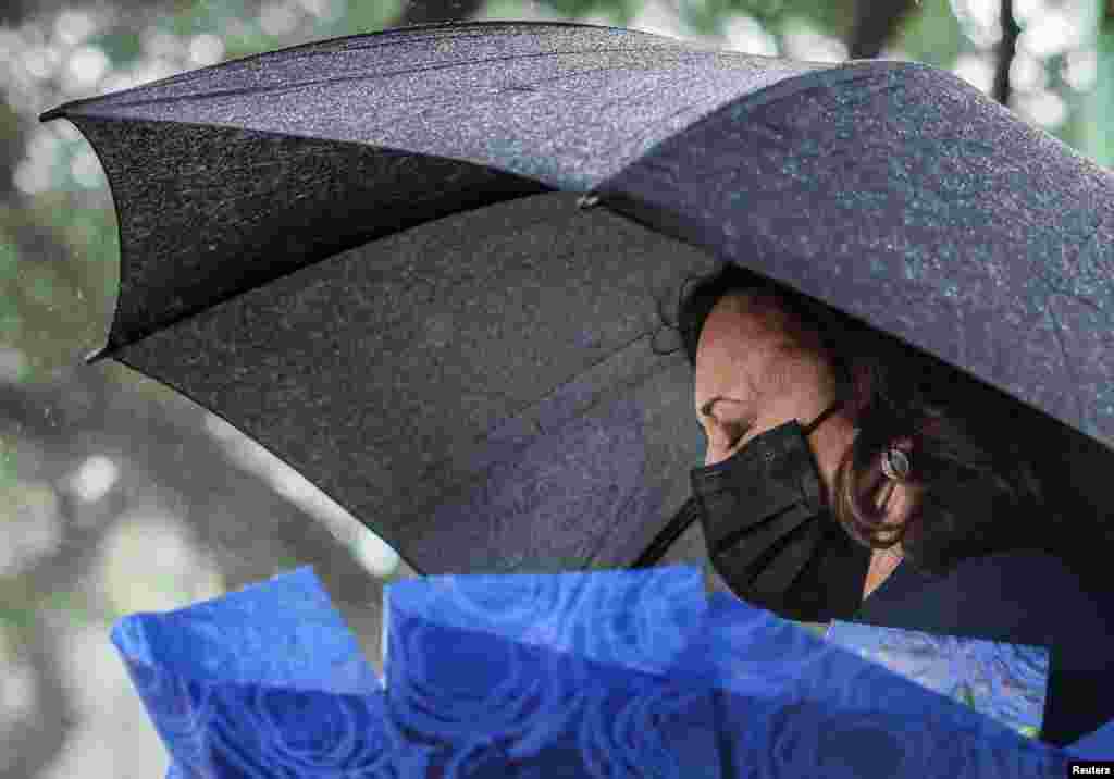 U.S. Vice President Kamala Harris lays flowers at Senator John McCain&#39;s memorial site, where his Navy aircraft was shot down by the North Vietnamese in Hanoi, Vietnam, on the three-year anniversary of his death.