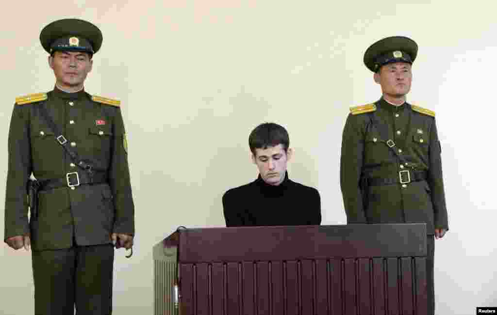 U.S. citizen Matthew Todd Miller sits in a witness box during his trial at the North Korean Supreme Court in this undated photo released by North Korea&#39;s Korean Central News Agency (KCNA), in Pyongyang, North Korea, Sept. 14, 2014. 