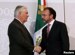 FILE - U.S. Secretary of State Rex Tillerson, left, and Mexico's Foreign Minister Luis Videgaray shake hands after a joint news conference at the Foreign Ministry in Mexico City, Feb. 23, 2017.
