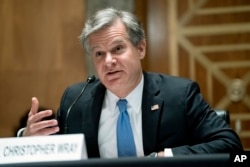 FILE - FBI Director Christopher Wray testifies on Capitol Hill in Washington, Sept. 21, 2021.