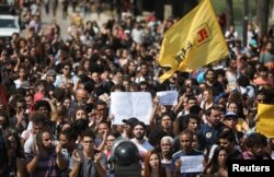 People protest in front of the National Museum of Brazil in Rio de Janeiro, Brazil, Sept. 3, 2018.