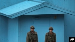 FILE - North Korean soldiers guard the truce village of Panmunjom at the Demilitarized Zone (DMZ) which separates the two Koreas.