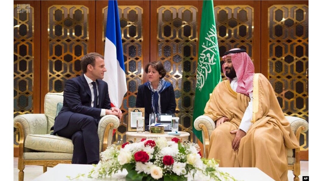 In this Nov. 9, 2017, photo released by Saudi Press Agency, SPA, Saudi Crown Prince Mohammed bin Salman meets with French President Emmanuel Macron upon his arrival in Riyadh, Saudi Arabia.