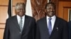 Kenyan President Mwai Kibaki (L) and Kenyan Prime Minister Raila Odinga (R)