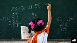 FILE - Researchers have found that poor children who tested lower on standardized tests had delays in brain development and volume. 