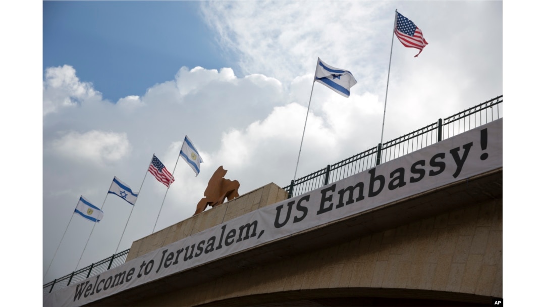 FILE - A sign is seen on a bridge leading to the U.S. Embassy compound ahead the official opening in Jerusalem, May 13, 2018.