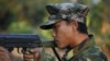 FILE - A Kachin soldier mans a frontline position, facing off against the Myanmar government.