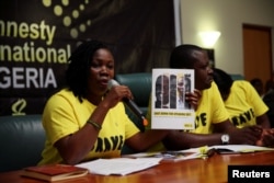 Esther Ikubaje, human rights campaigner, presents an Amnesty International report in Abuja, Nigeria, May 16, 2017.