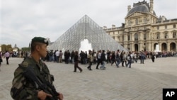 French soldiers patrol around the Louvre museum in Paris, Sunday, Oct. 3, 2010. The State Department has cautioned Americans traveling in Europe to be vigilant because of heightened concerns about a potential al-Qaida terrorist attack aimed at U.S. citize