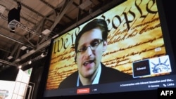 NSA whistleblower Edward Snowden speaks via videoconference at the "Virtual Conversation With Edward Snowden" during the 2014 SXSW Music, Film + Interactive Festival at the Austin Convention Center, March 10, 2014.