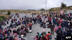 Indigenous people block a road in Santa Catarina Ixtahuacan, Guatemala on Dec. 21, 2021. 