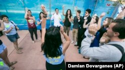 UCLA Students Against Anti Semitism cheer following a University of California’s Board of Regents meeting at the Student Center to discuss a controversial policy statement on intolerance in Irvine, California in September 2015. 