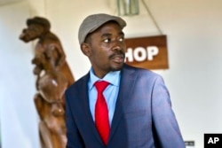 FILE - Opposition leader Nelson Chamisa leaves the Bronte hotel following his press conference in Harare, Zimbabwe, Aug. 3, 2018.