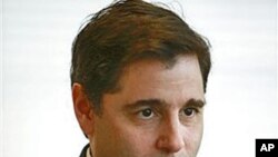 FCC Chairman Julius Genachowski is interviewed in his office in Washington, March 2010. (file photo)