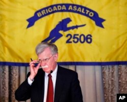 National Security Adviser John Bolton gestures while discussing new administration policy during a speech April 17, 2019, in Coral Gables, Fla., at the Bay of Pigs Veterans Association on the 58th anniversary of the United States' failed 1961 invasion of the island, an attempt to overthrow the Cuban government.