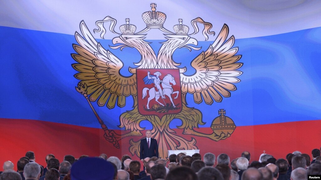 Russian President Vladimir Putin addresses Russian lawmakers, regional governors and other high-ranking officials, in Moscow, Russia, March 1, 2018.