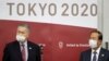 Ketua Panitia Penyelenggara Olimpiade 2020 Tokyo (TOGOC) Yoshiro Mori (kiri) dan CEO Toshiro Muto memberikan keterangan kepada media di markas besar TOGOC di Tokyo, 28 Januari 2021.