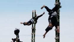 Members of the Edo Firemen Preservation Association perform Japanese traditional firefighting techniques during the New Year's fire brigades exercise in Tokyo on January 6, 2019.