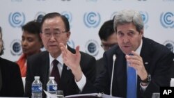 US Secretary of State John Kerry, right, delivers a speech as United Nations Secretary General Ban Ki-moon looks on during the Caring for Climate Business Forum event as part of the COP 21 United Nations conference on climate change, Dec. 8, 2015 in Le Bourget, on the outskirts of Paris. 