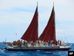 FILE - The Hokulea sailing canoe is seen off Honolulu, April 29, 2014. The Polynesian voyaging canoe is returning to Hawaii after a three-year journey around the world guided only by nature with navigators using no modern navigation across 40,000 nautical miles.